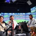 Dynamic sports broadcasting studio with engaging commentators and high-tech equipment.